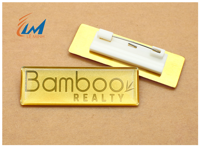 Huy hiệu đồng ăn mòn nổi không xi vàng, không phủ màu