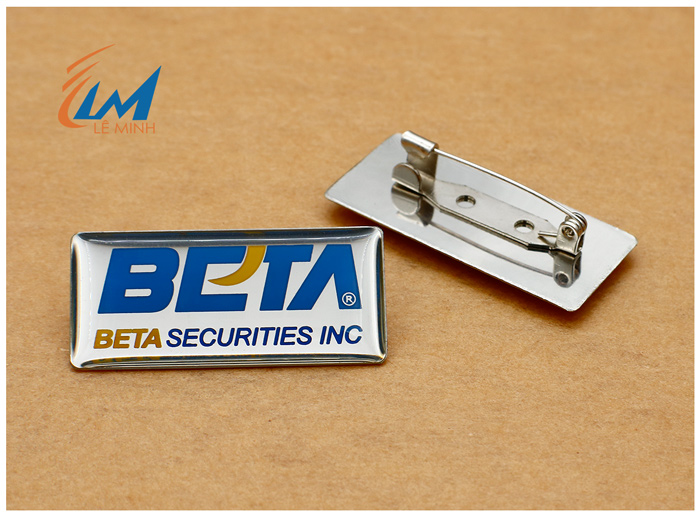 huy hiệu inox ăn mòn phủ màu theo yêu cầu