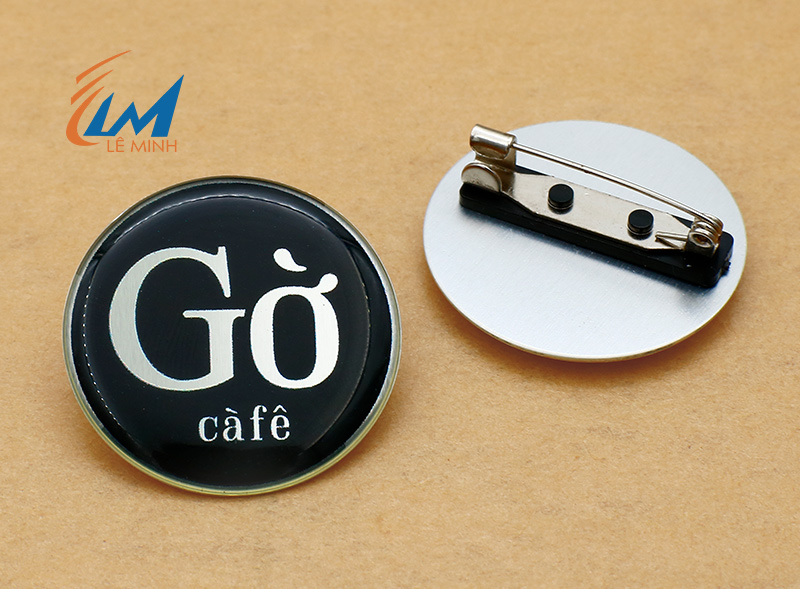 huy hiệu nhôm tròn in uv